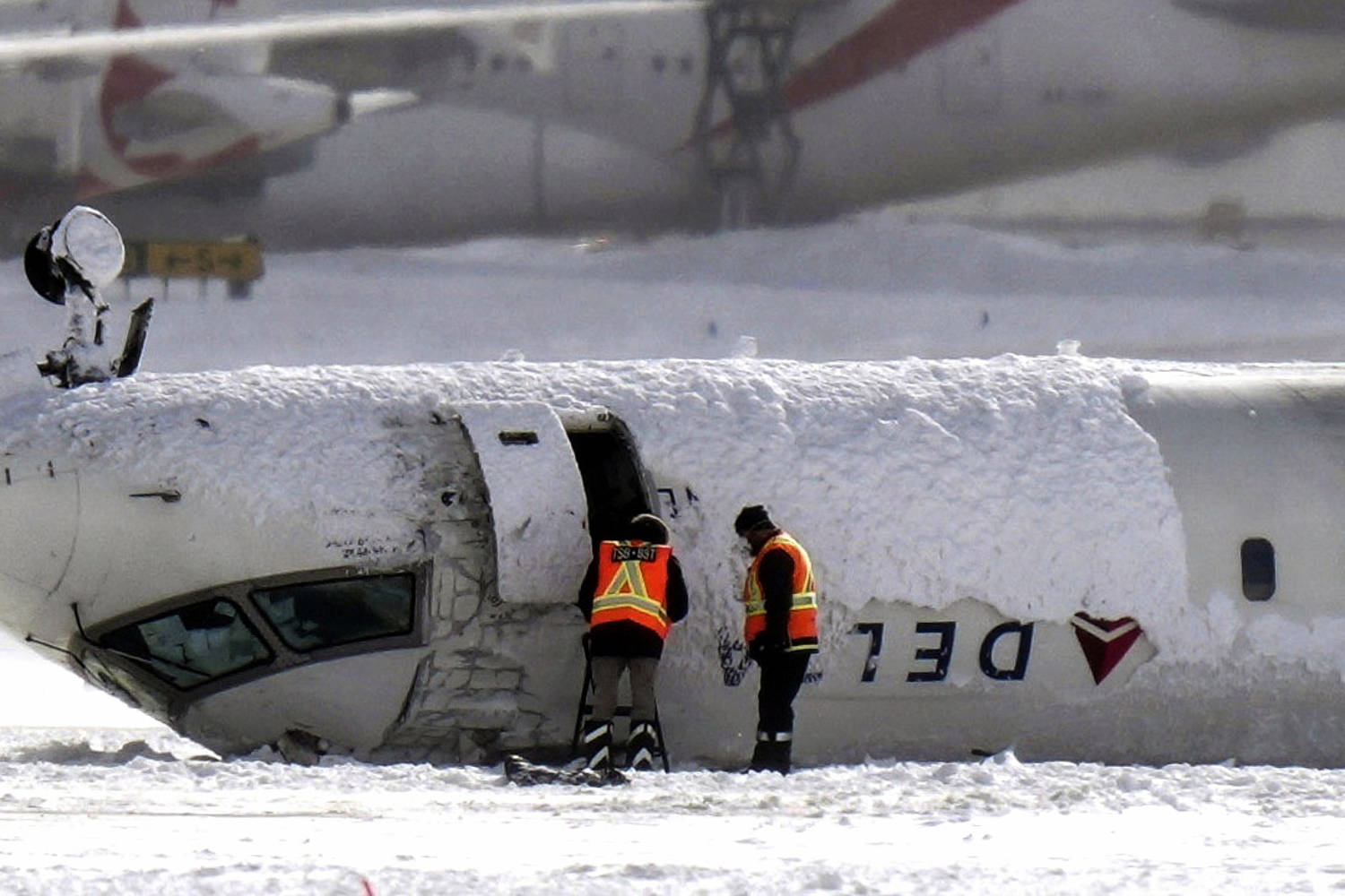 Two passengers sue Delta after plane rolls over during crash-landing in Toronto