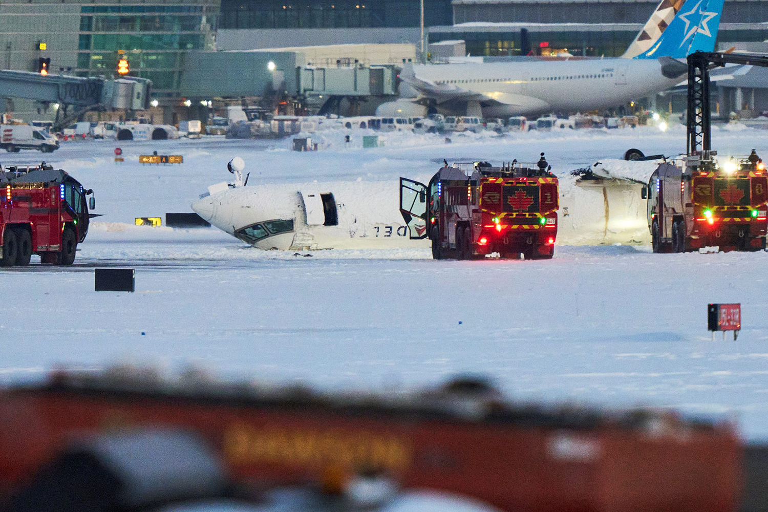 Passenger on flipped Delta jet recalls being upside down and 'hanging from our seat belts'