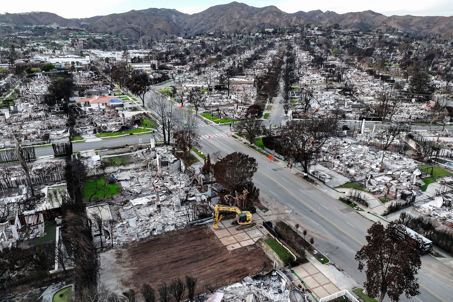 LA officials issue evacuation warnings for wildfire-affected areas ahead of heavy rain