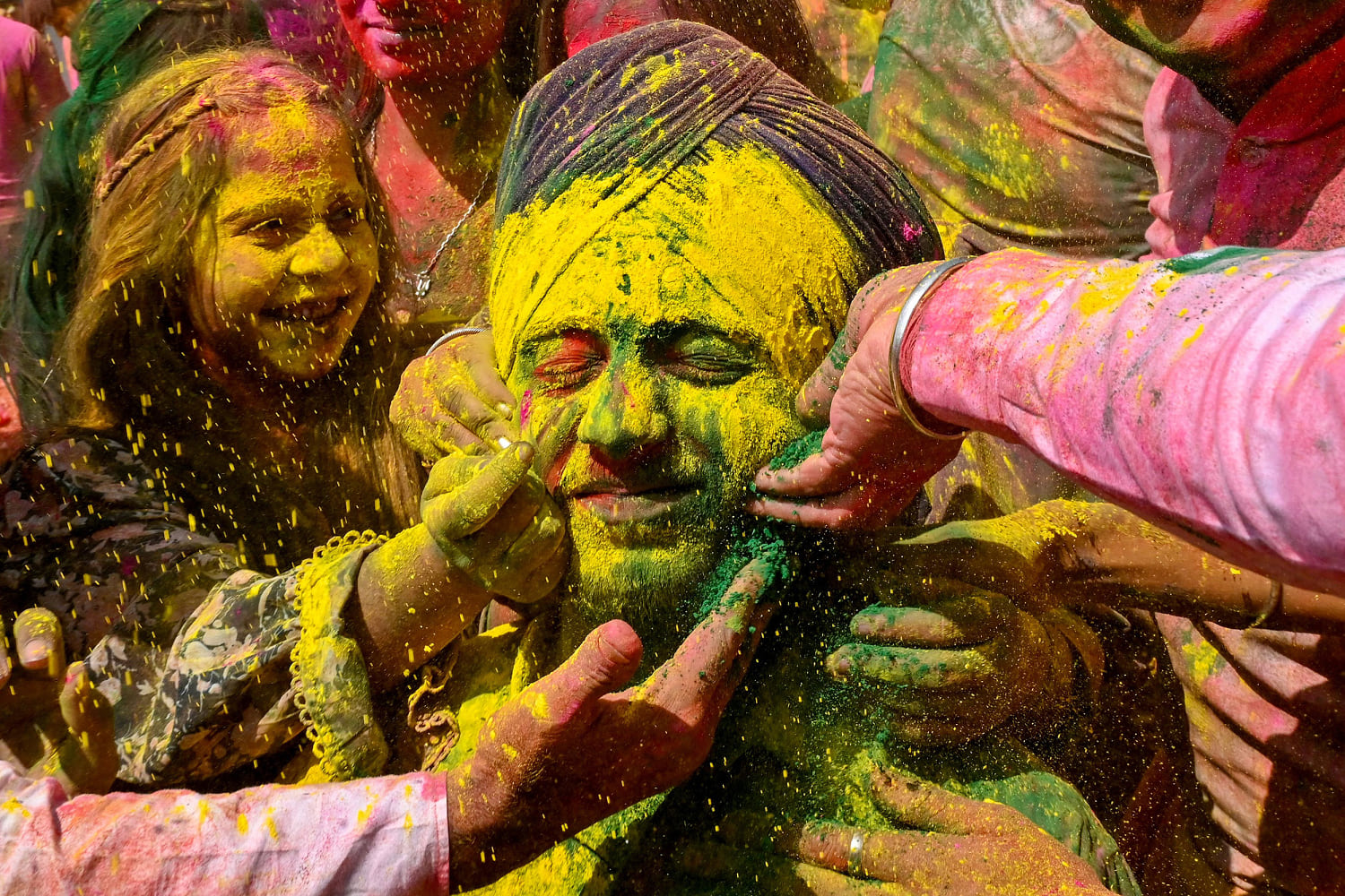 Water Balloons and Bollywood, India covers itself with color on Holi festival