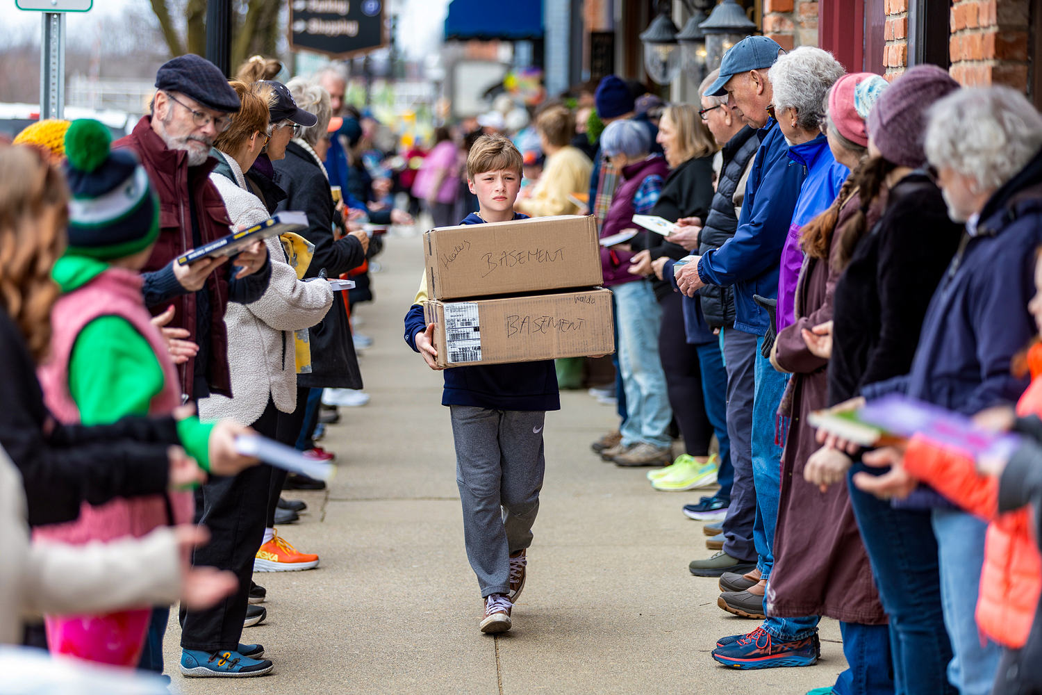 A Michigan community takes a novel approach to moving 9,100 books for shop's next chapter