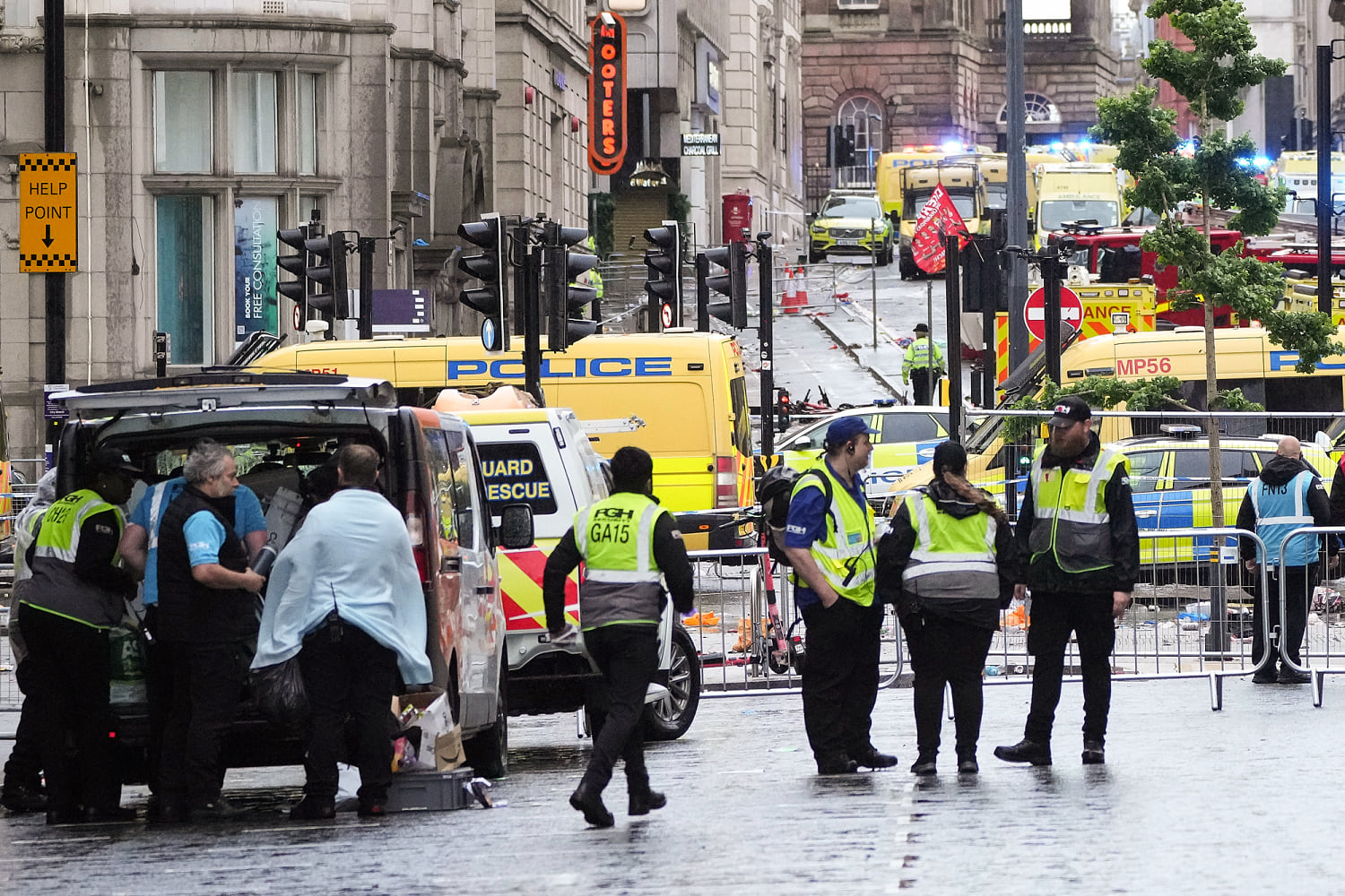 Car collides with pedestrians at parade celebrating soccer win in Liverpool, England
