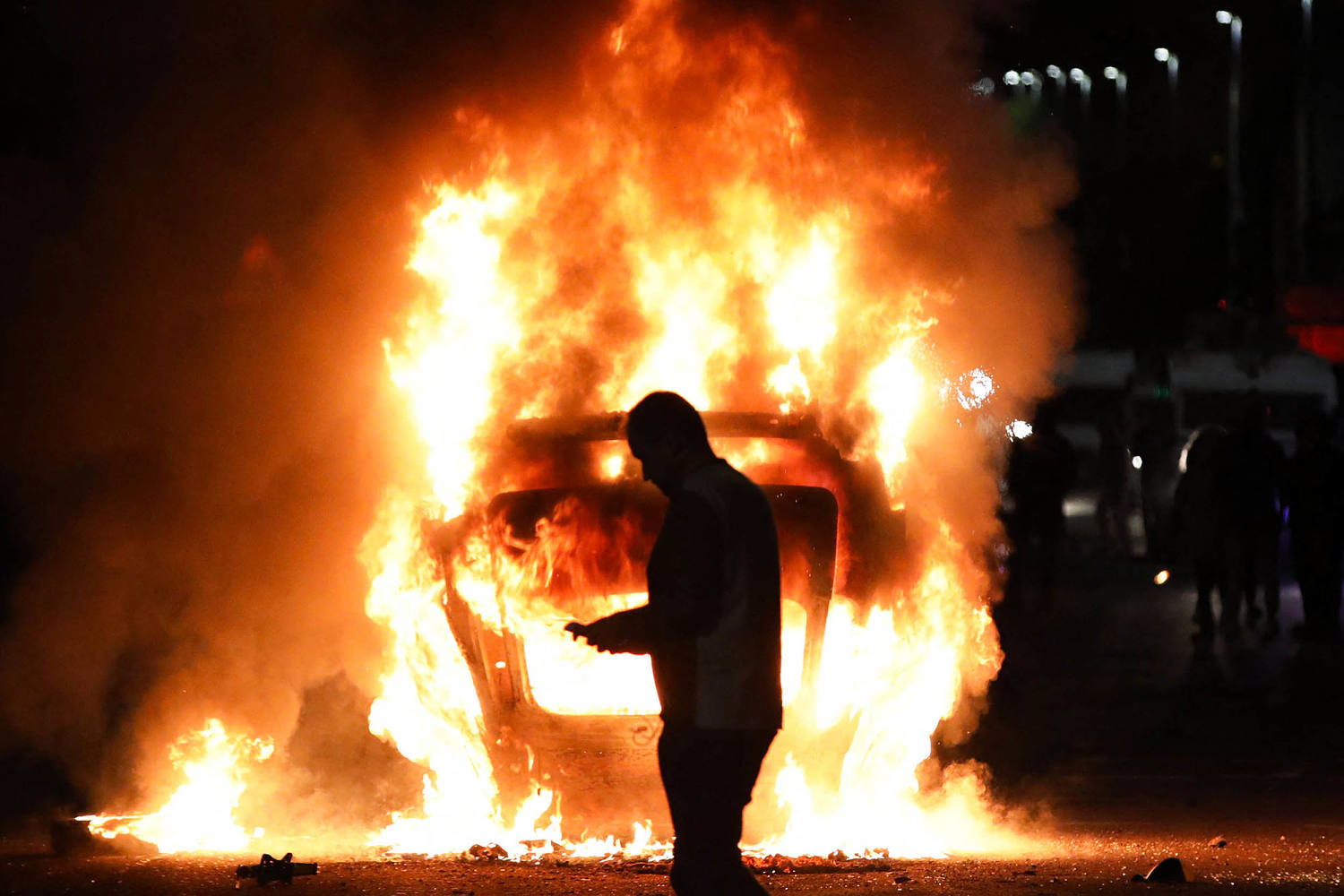 Rioters attack police and torch houses for a second night in Northern Ireland