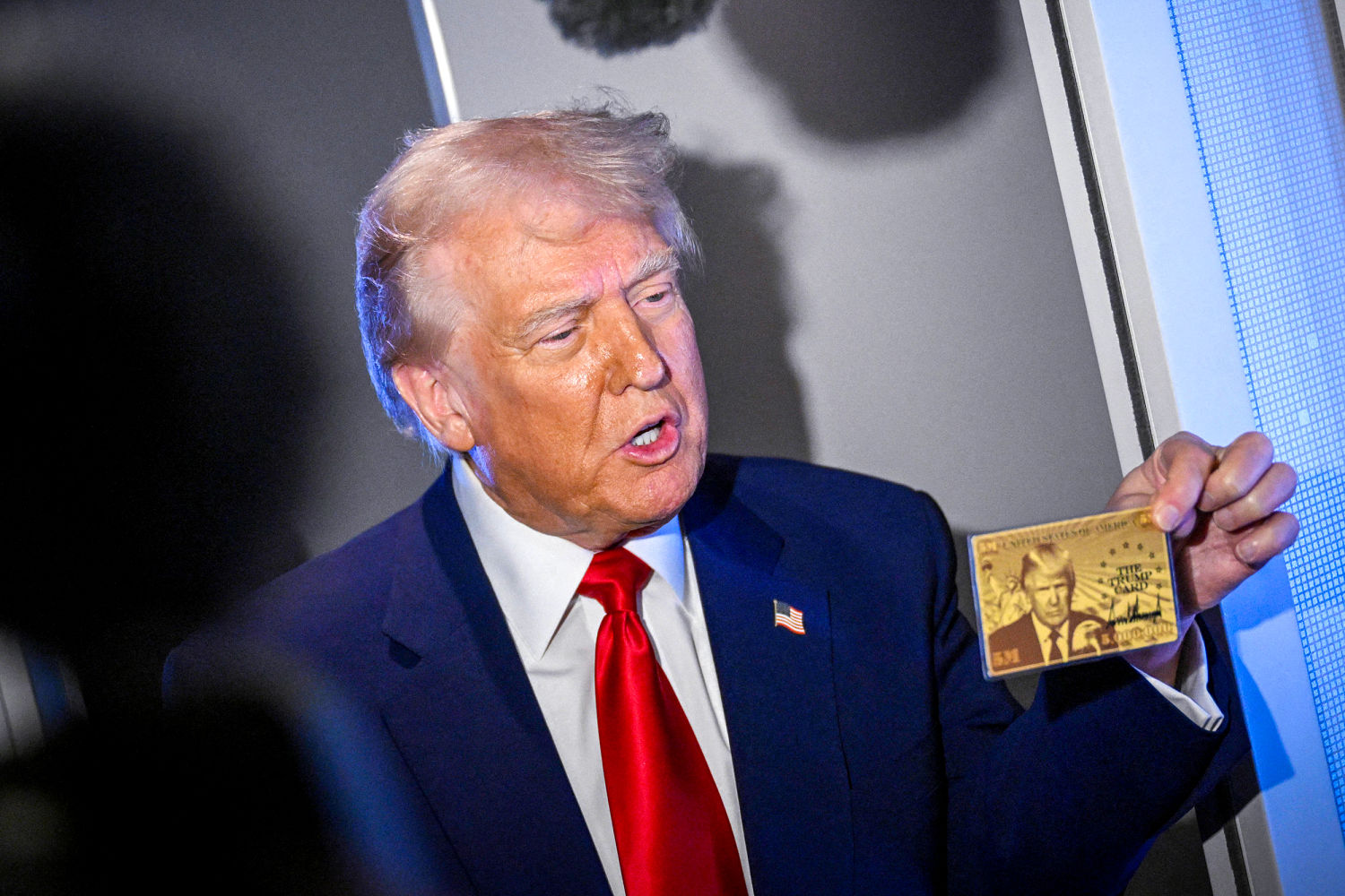 Touting ‘Trump Cards,’ president makes dubious claims, unveils weird new website