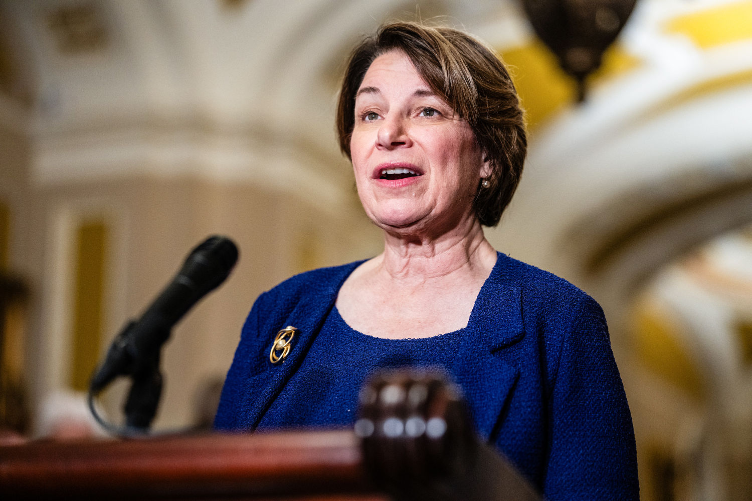 Sen. Amy Klobuchar says authorities believe suspect in 'politically motivated assassination' is still in the Midwest