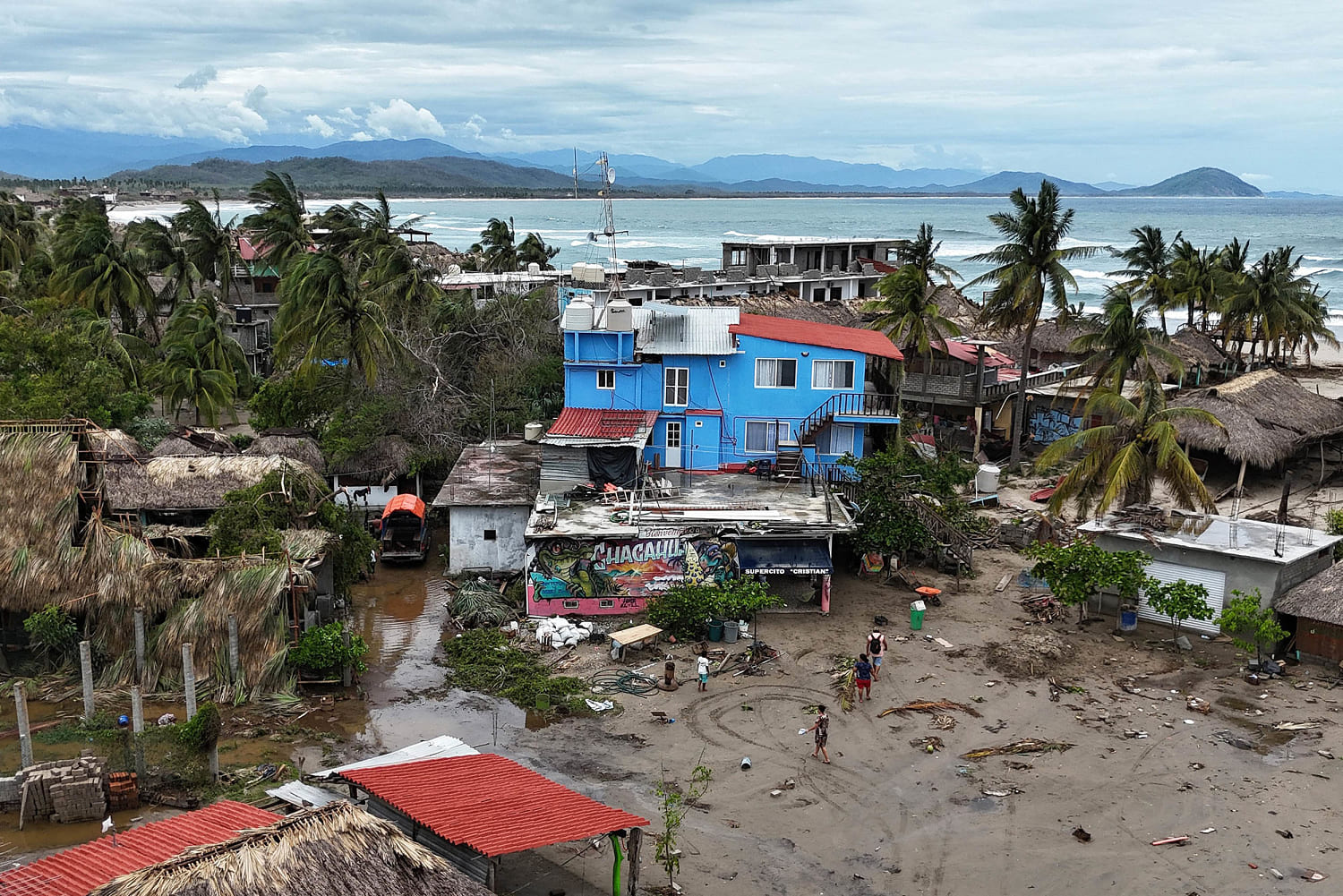 Mexico assesses damage from Hurricane Erick as rising rivers leave at least 1 dead