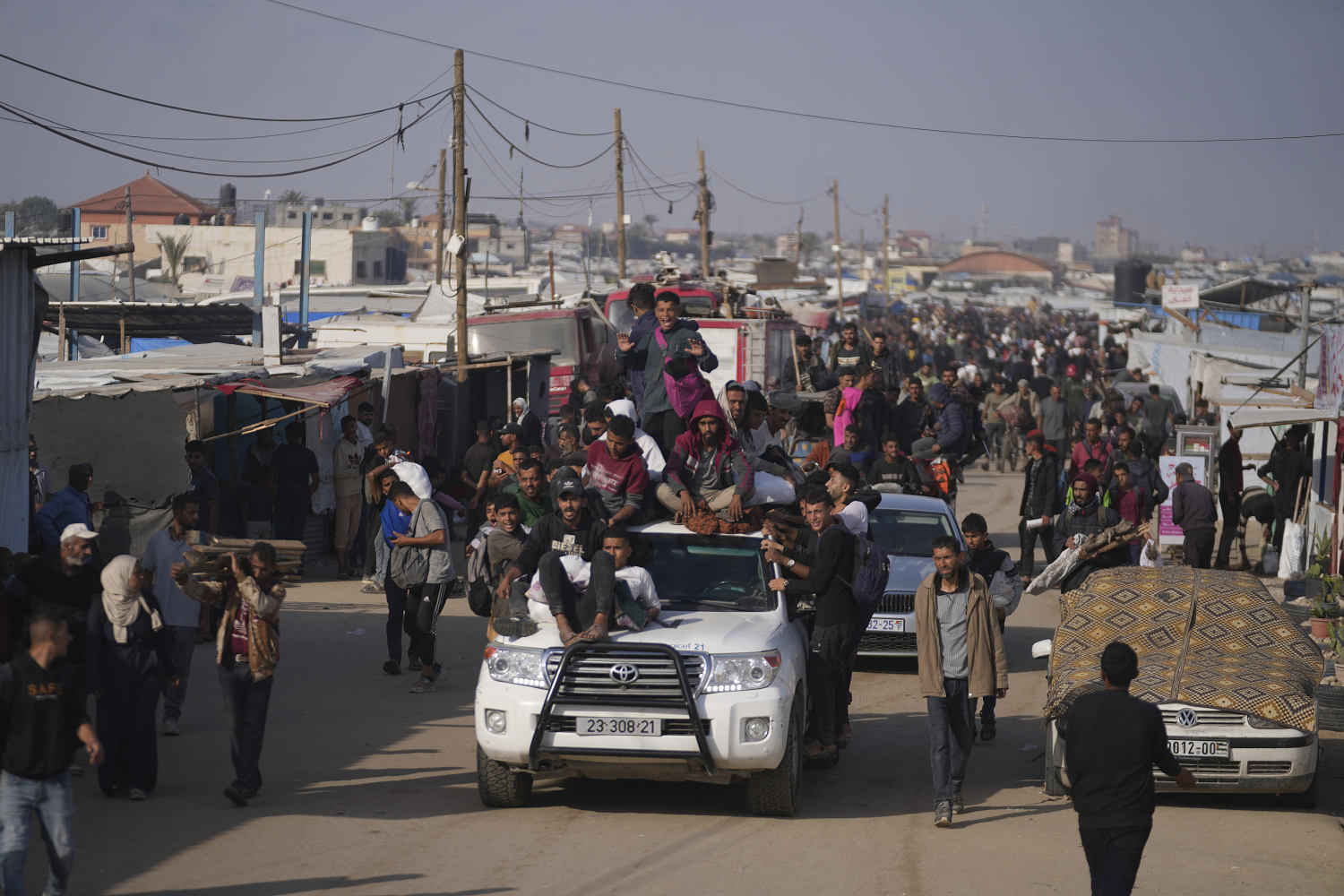 Dozens feared killed after Israeli tank fires on crowd waiting for aid in Gaza, witnesses say
