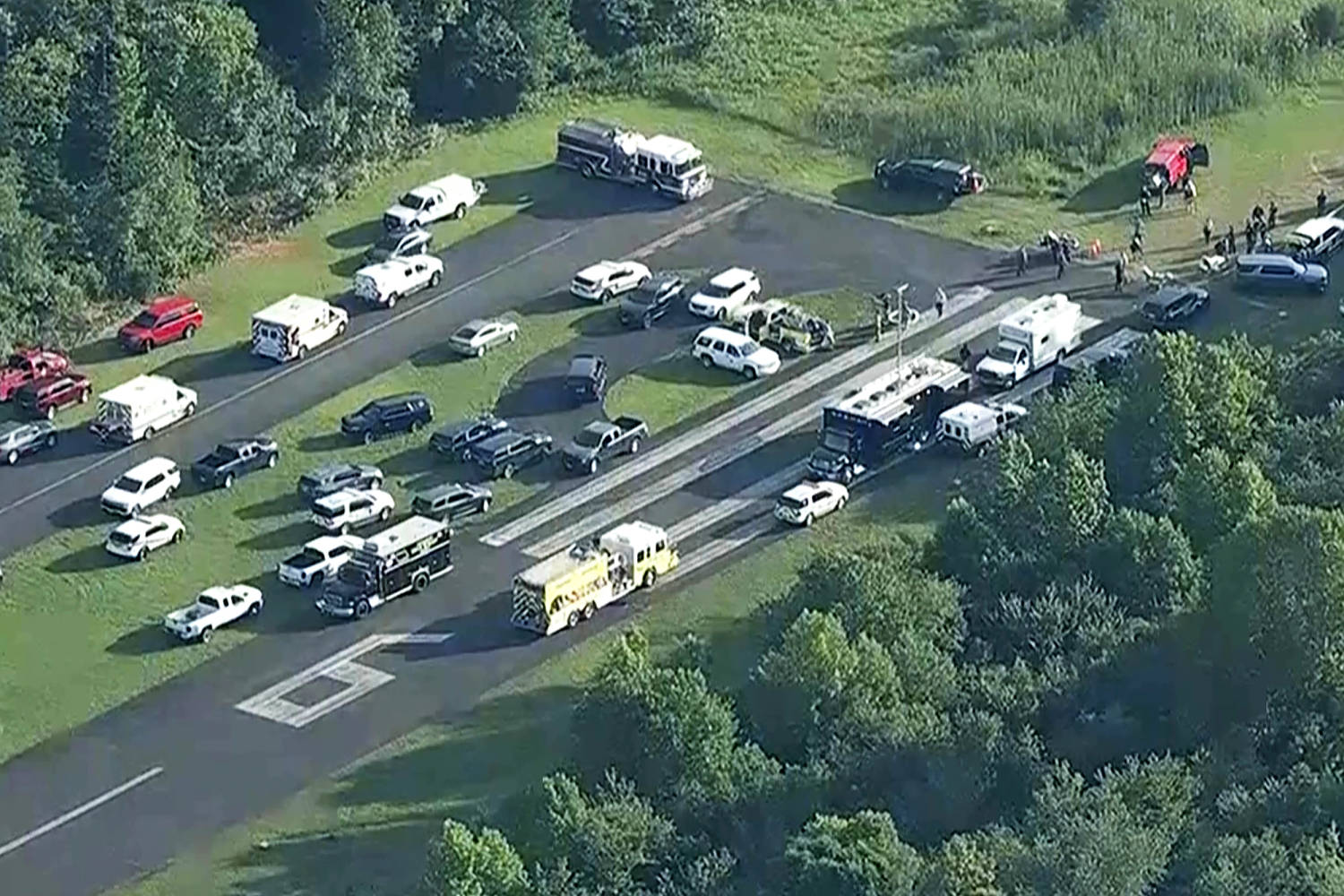Skydiving plane goes off New Jersey runway into woods, sending 15 to hospital
