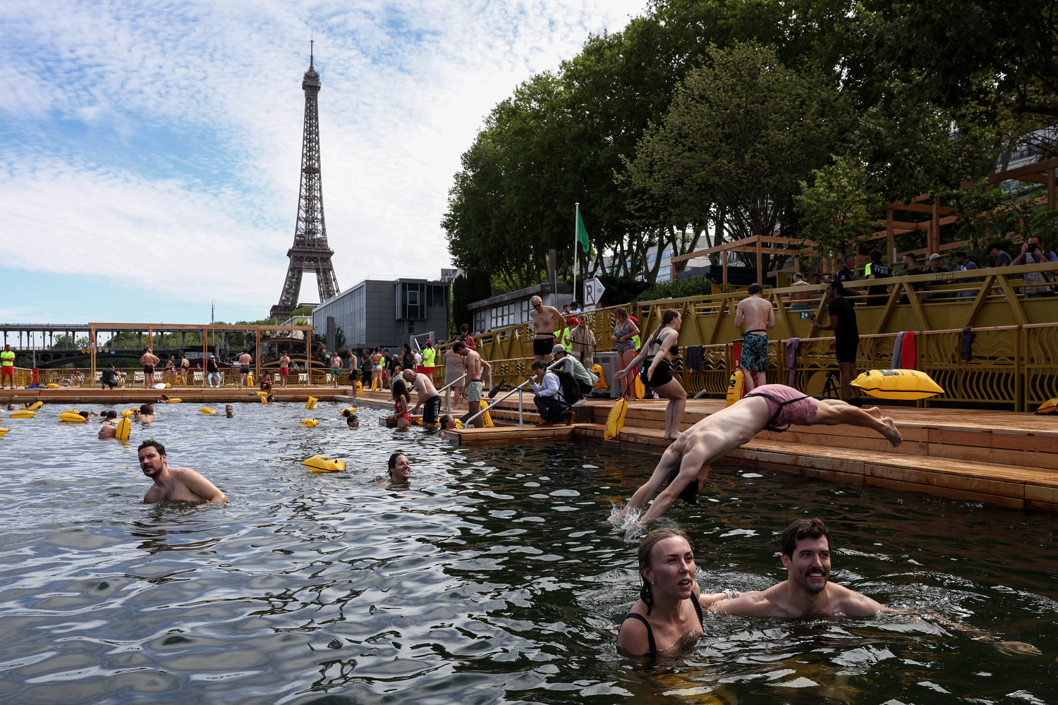 Joyful Parisians take a historic plunge into the Seine after 100 years