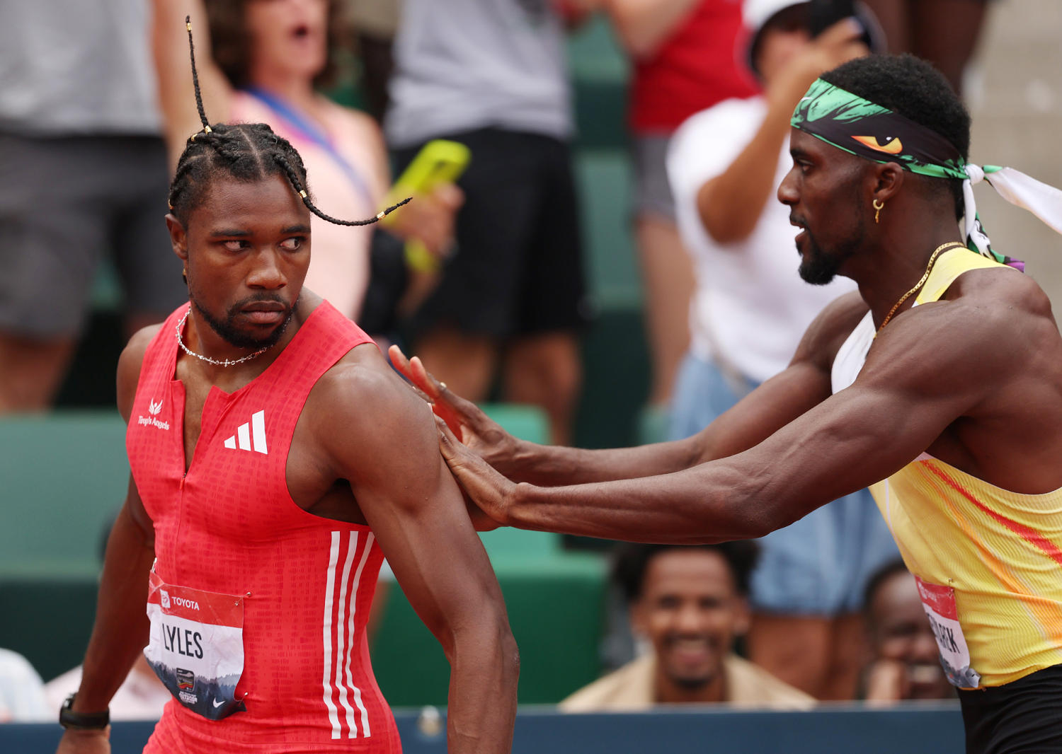 Noah Lyles gets shoved by rival Kenny Bednarek after rallying for win in 200