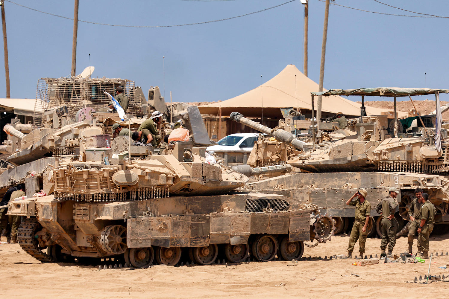Satellite images show Israel preparing for a possible ground invasion of Gaza, sources say