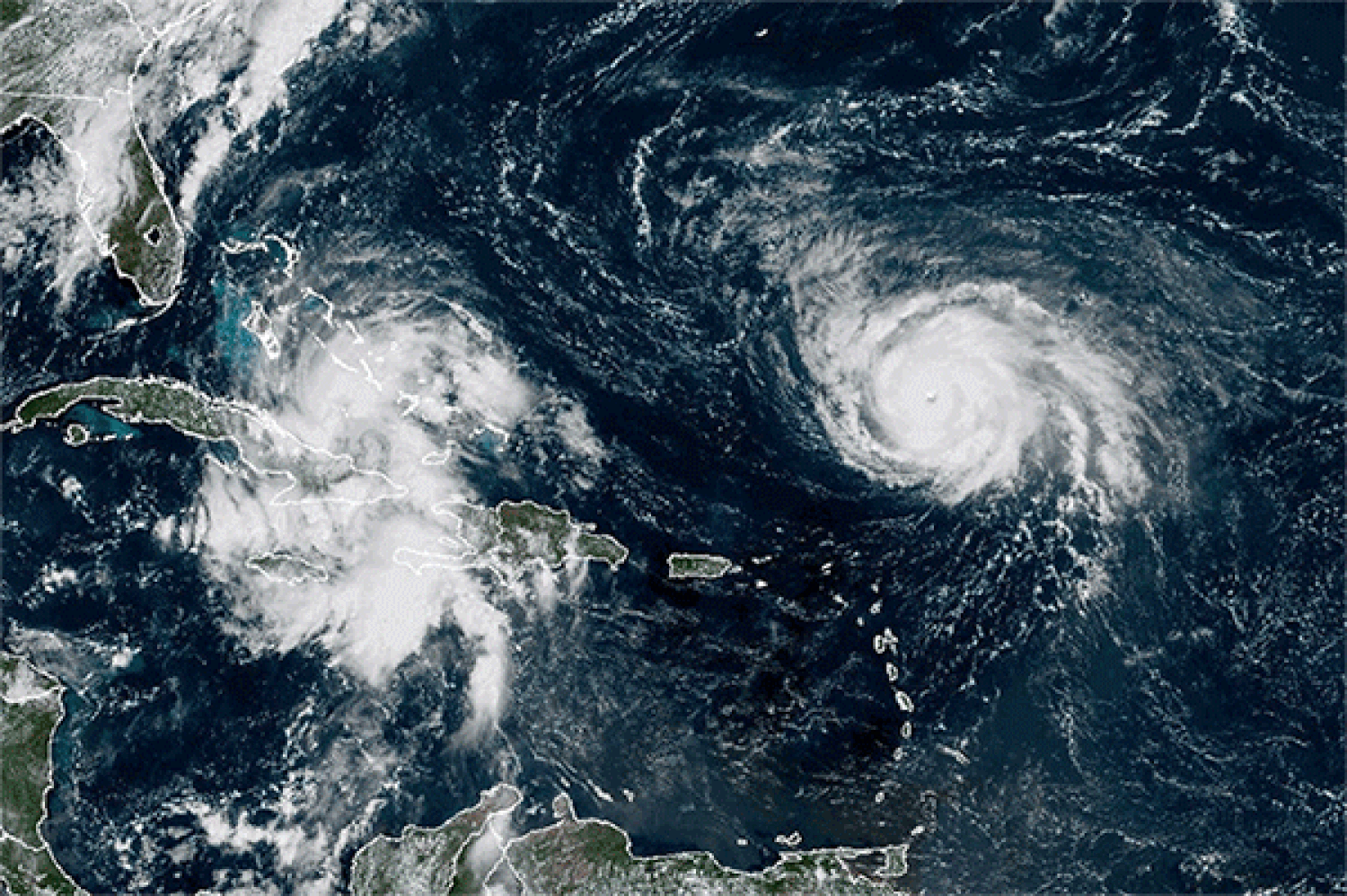 Tropical depression forms near Bahamas as Hurricane Humberto rips through the Atlantic