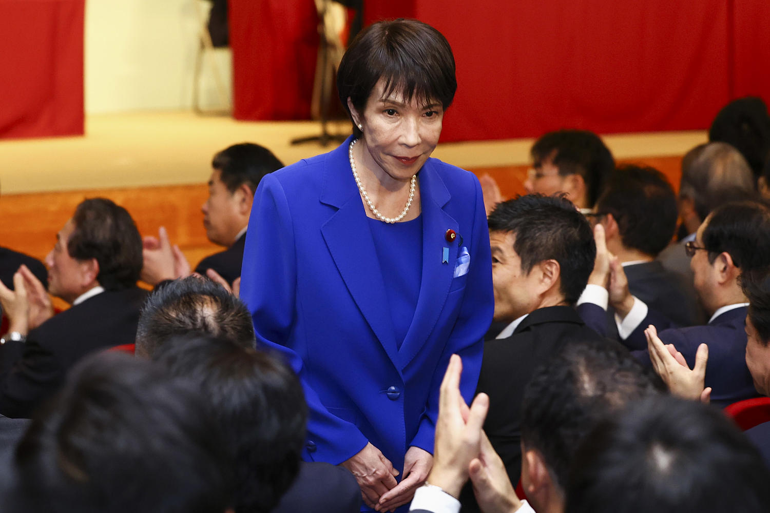 Japan's first female governing-party leader is an ultra-conservative star in a male-dominated group