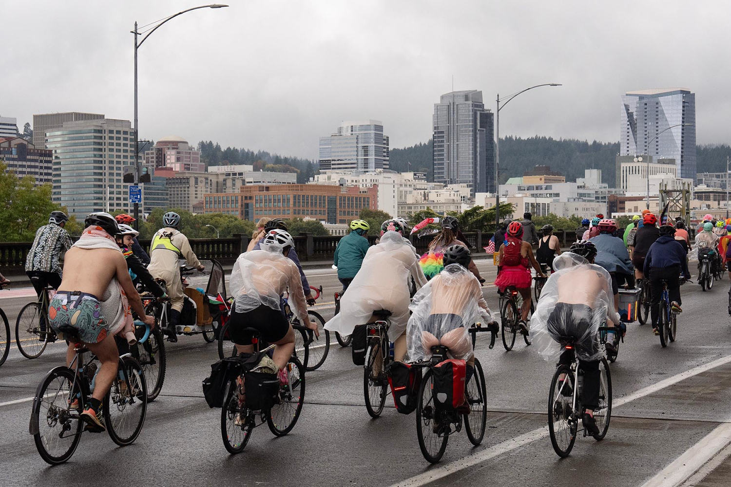 In Portland, nude cyclists join anti-ICE protests in a rain-soaked ride