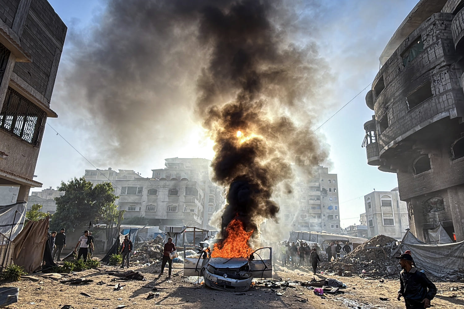 Israel launches strikes in Gaza ceasefire's latest test as hospitals say more than 20 killed