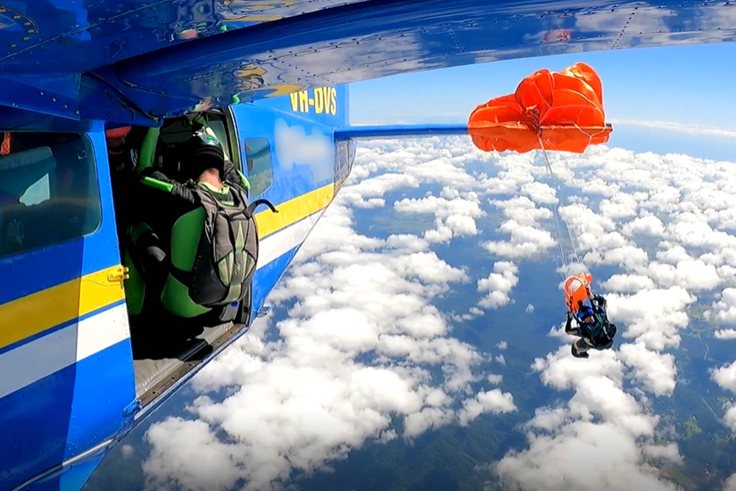 Skydiver suspended at 15,000 feet after parachute gets snagged on plane's tail
