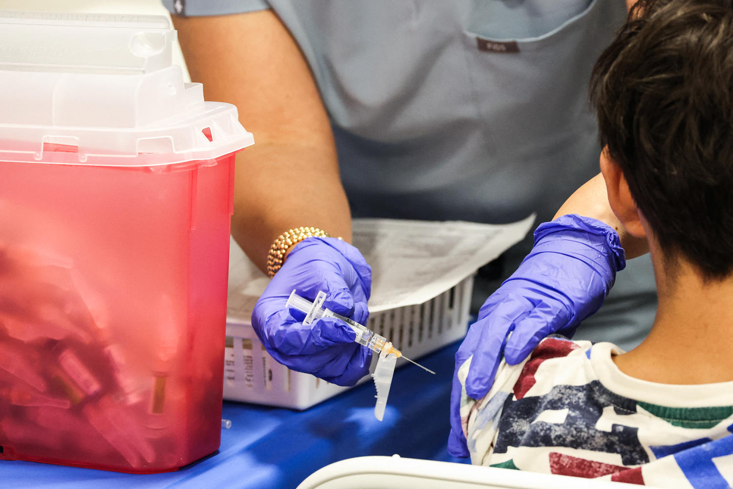 Doctors break with CDC on vaccine guidance for children