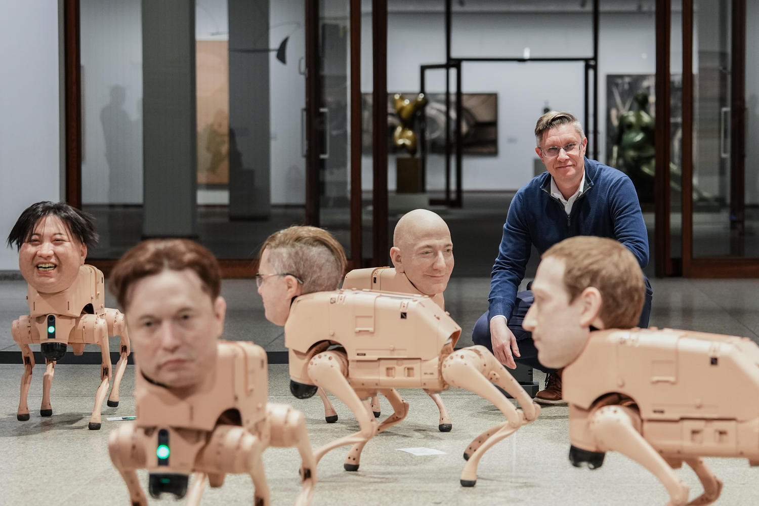 Robot dogs with Musk and Zuckerberg heads roam around Berlin museum in Beeple's new exhibit