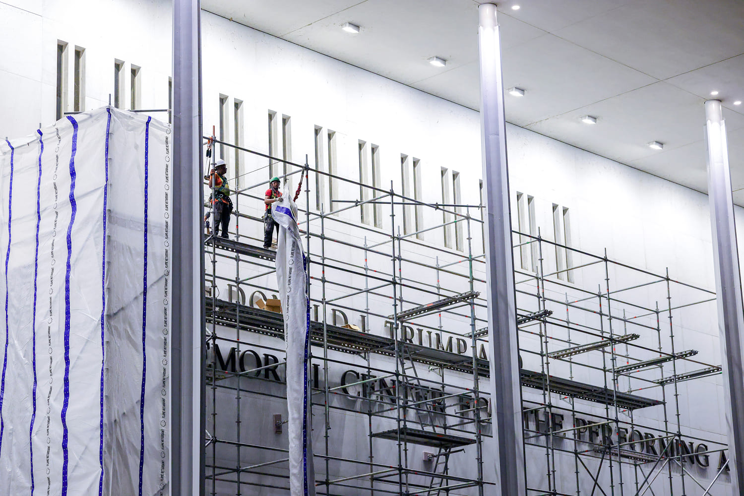 Construction workers begin removing Trump’s name from the Kennedy Center