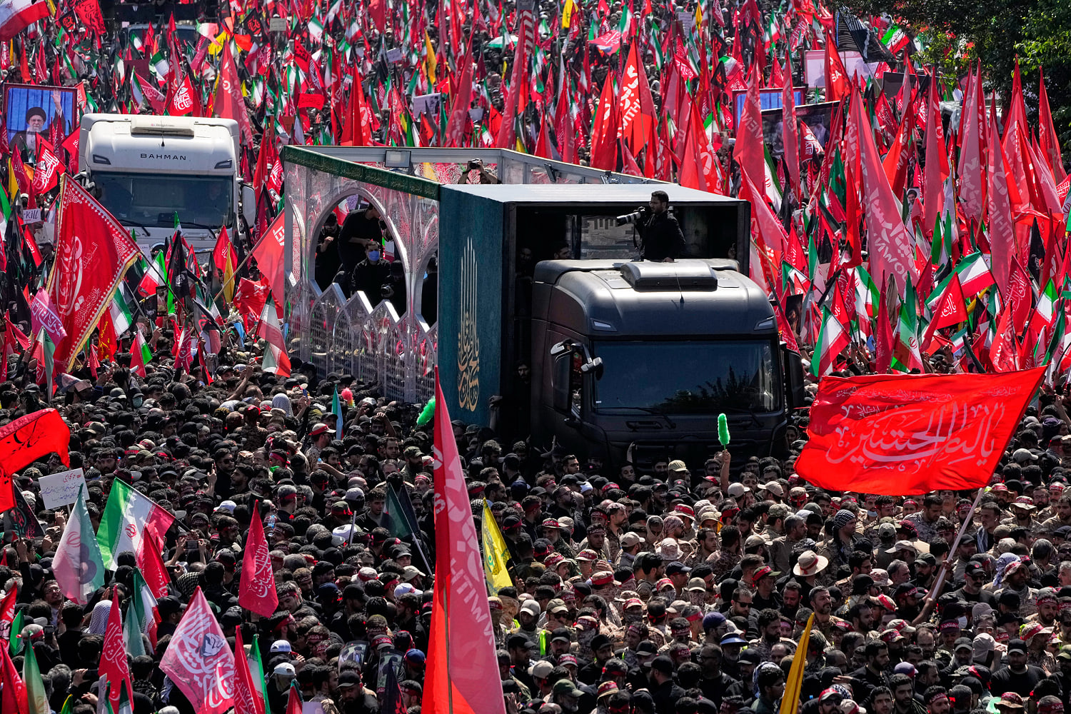 Supreme leader’s coffin creeps through crowds in Tehran as Trump effigy is hanged