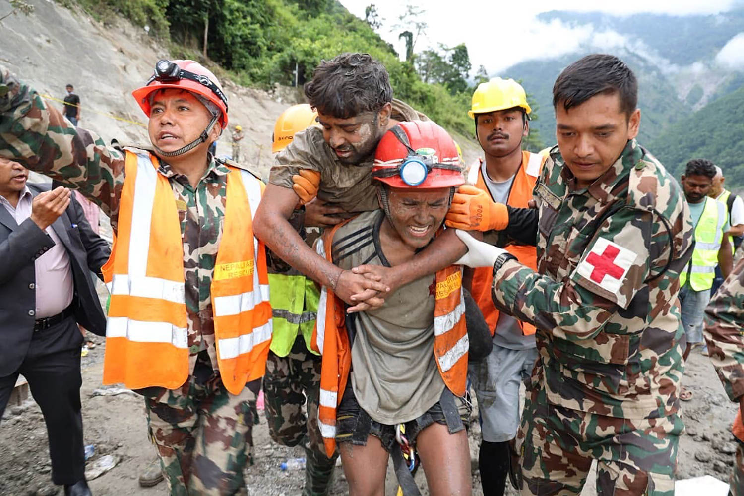 Two trapped workers are pulled alive from Nepal tunnel more than a week after deadly floods
