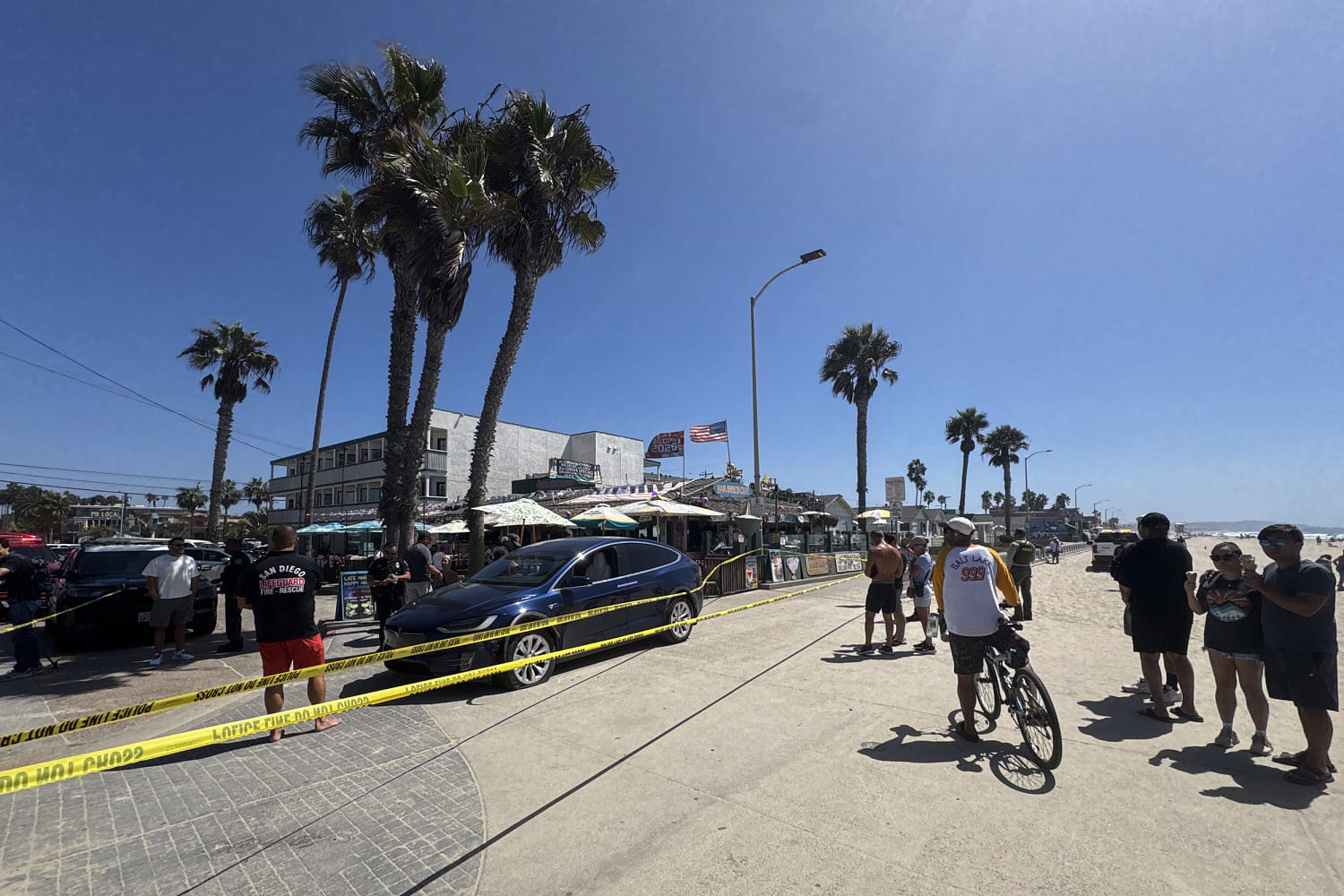 Bystanders chase down man accused of striking woman while speeding in stolen car on San Diego boardwalk