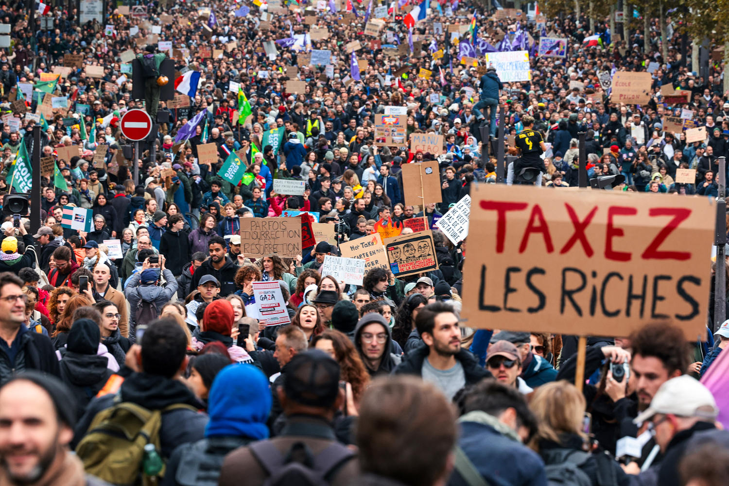 Mass protests challenge Macron as French police use tear gas and water cannons
