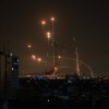 An Israeli missile launched from an Iron Dome system attempts to intercept a rocket