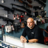 David Kowalsky, 48, owner of Florida Gun Store, stands for a portrait in his shop in Hollywood, Fla.