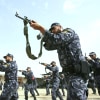 Members of the Hamas led-government executive security forces take part in an armed exercise