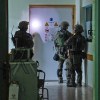 A photo released Wednesday by the Israeli army shows soldiers carrying out operations inside Al-Shifa hospital in Gaza City.