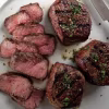 Omaha Steaks sirloins cut up on a plate