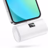 Mini power bank plugged into phone. 