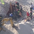 18-year-old dies after sand collapses on him while digging hole