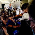 Watch: Children’s orchestra turns flight delay into musical moment