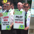 Airline pilots picket over fatigue, overtime, as cancellations surge