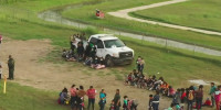 Migrant families and children on difficult decision to cross the border