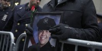 City mourns 22-year-old NYPD officer as U.S. sees alarming rise in gun violence