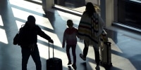 Travelers face delays in big post-holiday rush back home
