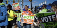 Early voters line up in Georgia for Warnock-Walker Senate runoff