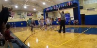 Middle school kid hits a full court shot right at the buzzer