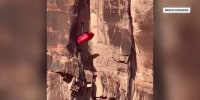 Base jumper seen crashing into cliff in frightening video