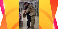 Deployed military husband surprises wife with coffee at work