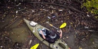 Man swaps fishing rod for trash bag to clean Cleveland river