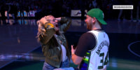 Milwaukee Bucks fan proposes to girlfriend during half-time contest