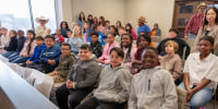 Classmates surprise friend at adoption ceremony