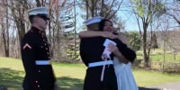 Tearful reunion: Marines surprise their older sister at her wedding