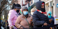 Image: FILE PHOTO: People line up to receive free holiday boxes of food ahead of the Thanksgiving holiday in New York