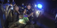 Image: This image from video from Louisiana state police state trooper Dakota DeMoss' body-worn camera, shows troopers holding up Ronald Greene before paramedics arrived on May 10, 2019, outside of Monroe, La.