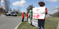 Protesters at the entrance to the Edna Mahan Correction Facility in Clinton, N.J., on March 27, 2021.